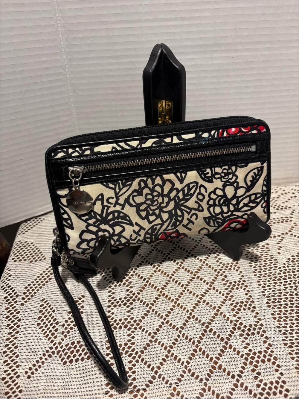 Coach Black and Cream Floral Wristlet with Red Accents